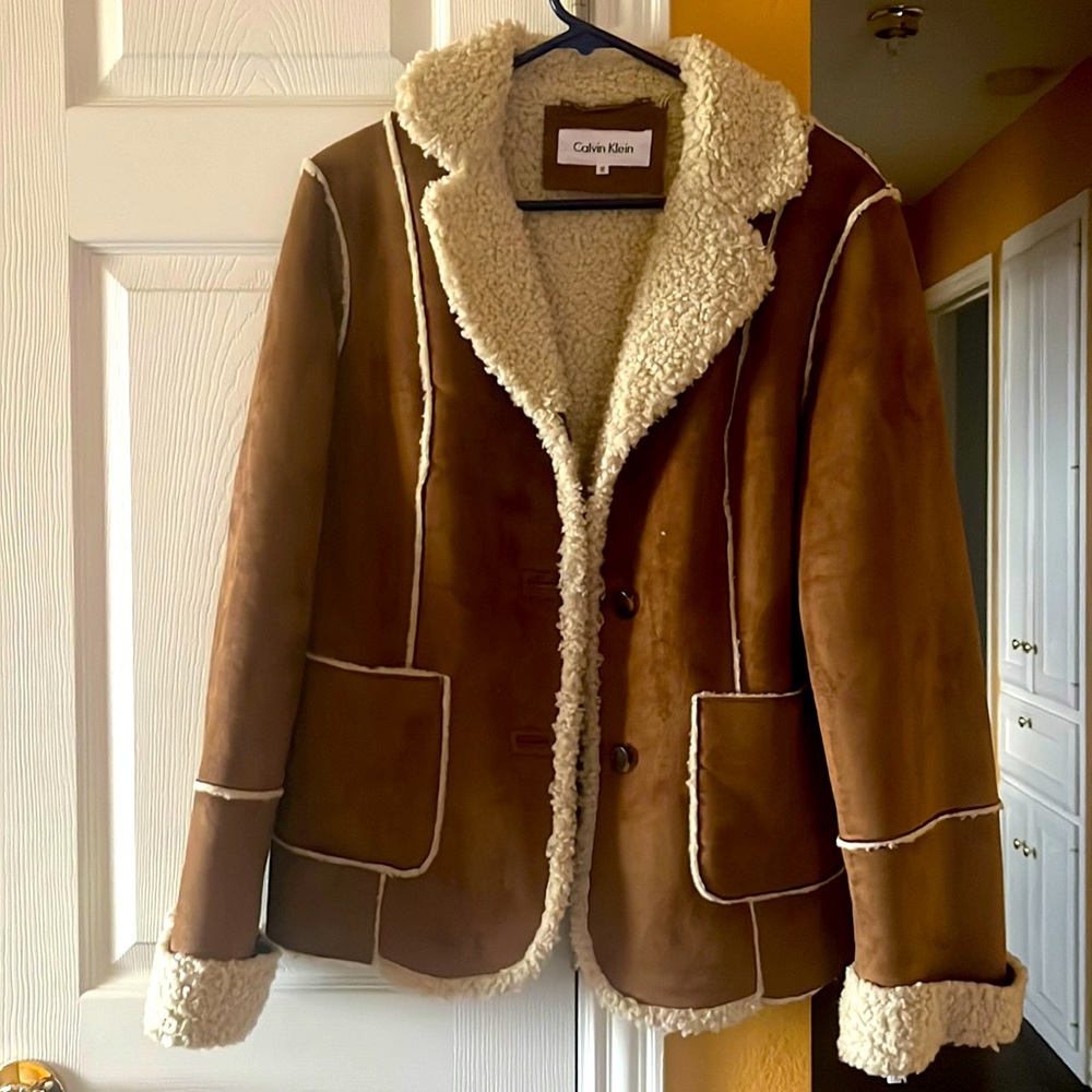 Brand new, never worn coat with sheepskin lining